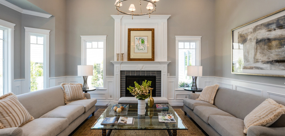 Inspiration for a medium sized traditional open plan living room in Los Angeles with beige walls, dark hardwood flooring, a standard fireplace, a brick fireplace surround and no tv.