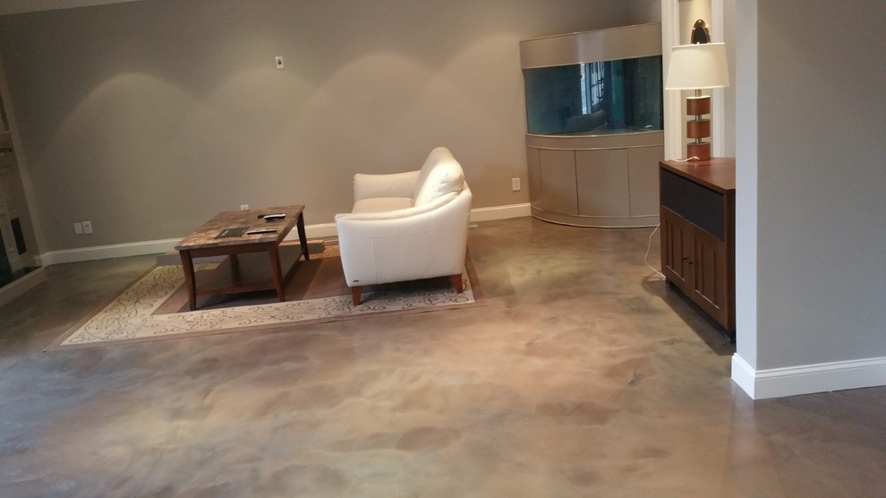 Inspiration for a modern games room in New York with beige walls, concrete flooring and beige floors.