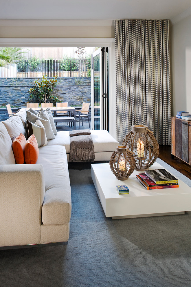 Trendy carpeted family room photo in San Francisco with beige walls