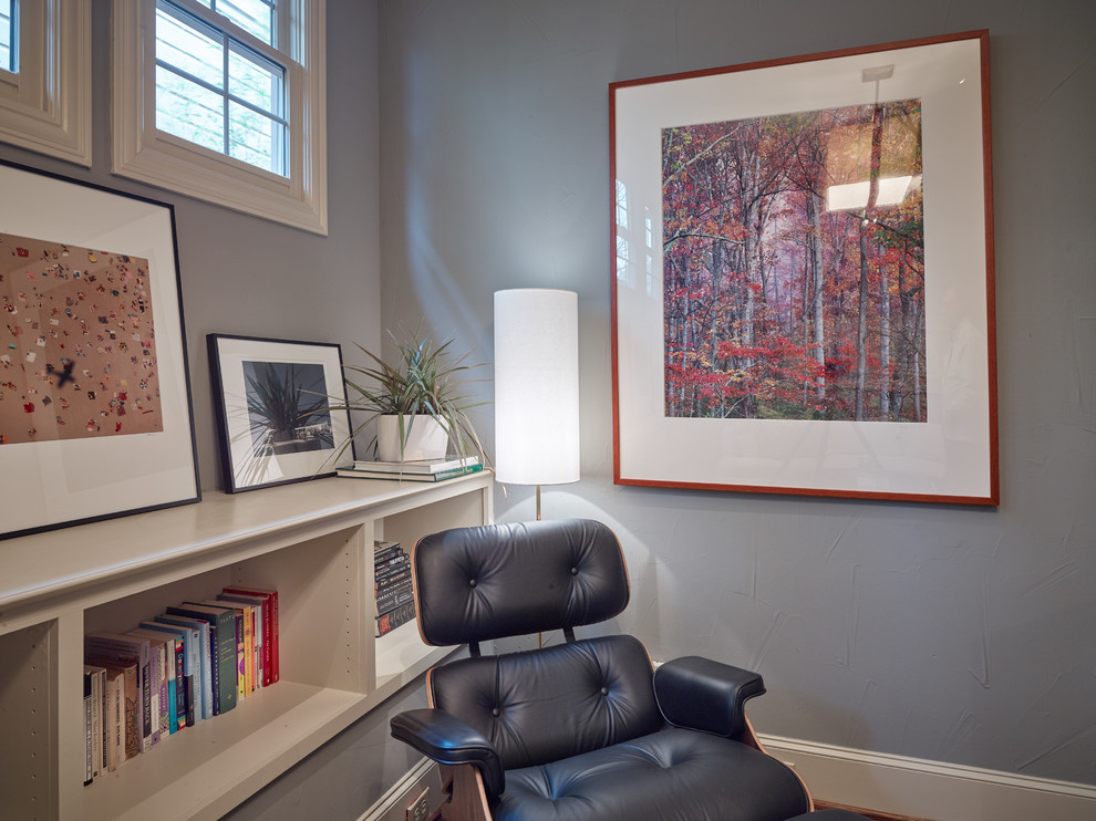 This is an example of a medium sized bohemian enclosed games room in Dallas with a reading nook, grey walls, medium hardwood flooring and brown floors.