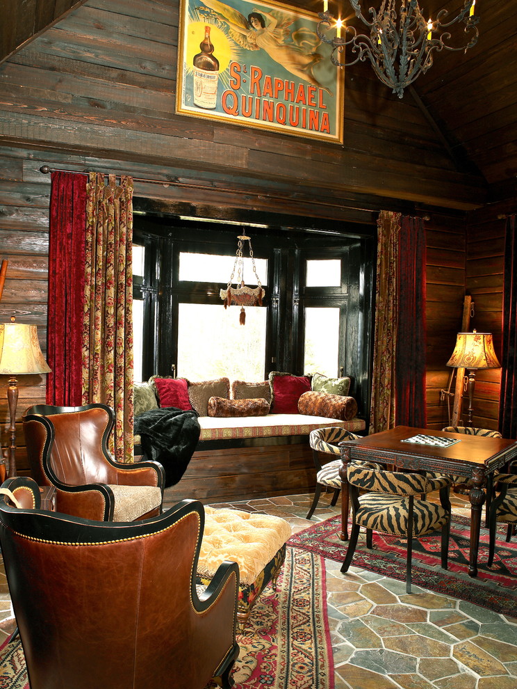 This is an example of a medium sized bohemian enclosed games room in Other with grey walls, slate flooring and no fireplace.