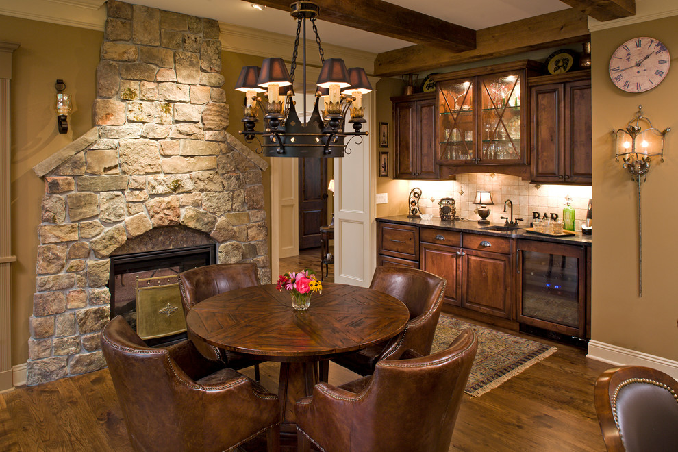Inspiration for a large timeless open concept medium tone wood floor family room remodel in Minneapolis with a two-sided fireplace and a stone fireplace