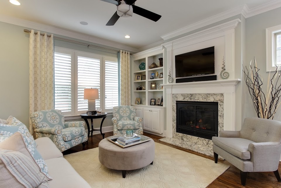Example of a transitional family room design in Raleigh
