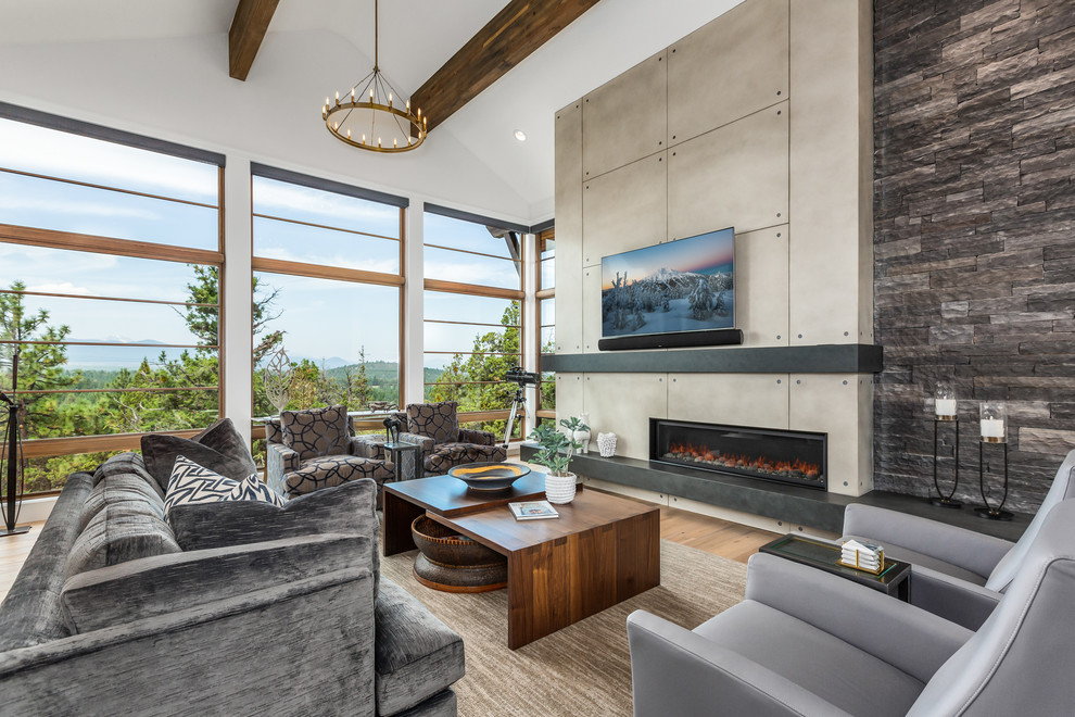 Medium sized contemporary open plan games room in Other with white walls, light hardwood flooring, a ribbon fireplace, a concrete fireplace surround, a wall mounted tv and a feature wall.