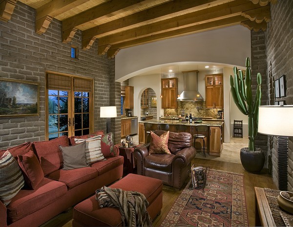 Example of a mid-sized southwest open concept medium tone wood floor family room design in Phoenix with beige walls, no fireplace and no tv