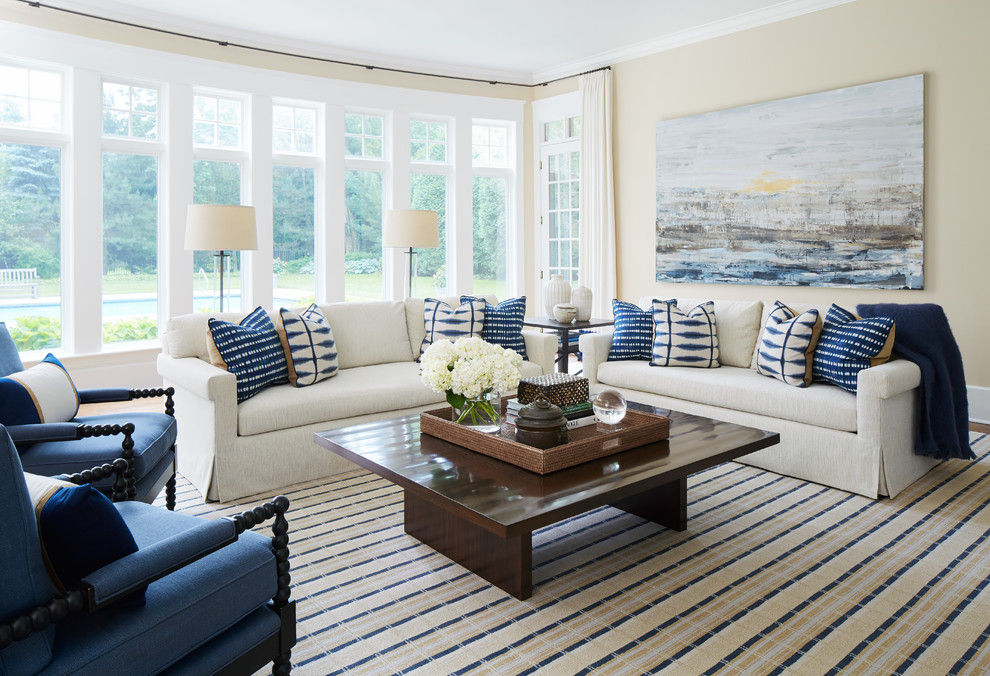 Example of a large transitional open concept medium tone wood floor and brown floor family room design in Chicago with beige walls, no fireplace and no tv