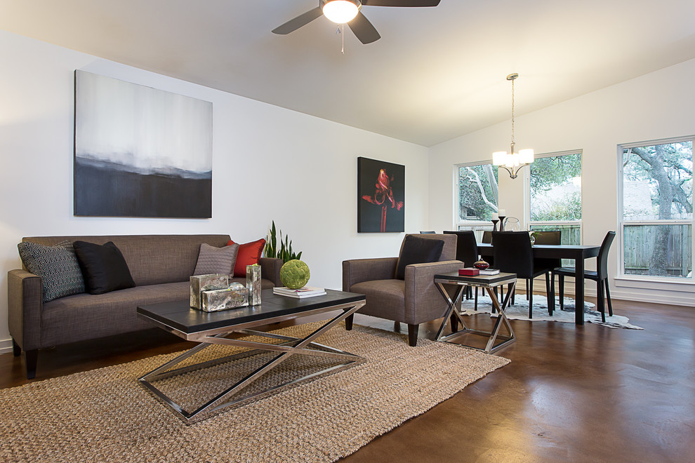 Large minimalist open concept concrete floor family room photo in Austin with white walls and a wall-mounted tv