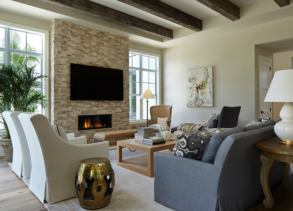 Inspiration for a transitional light wood floor living room remodel in Miami with white walls, a ribbon fireplace, a stone fireplace and a wall-mounted tv