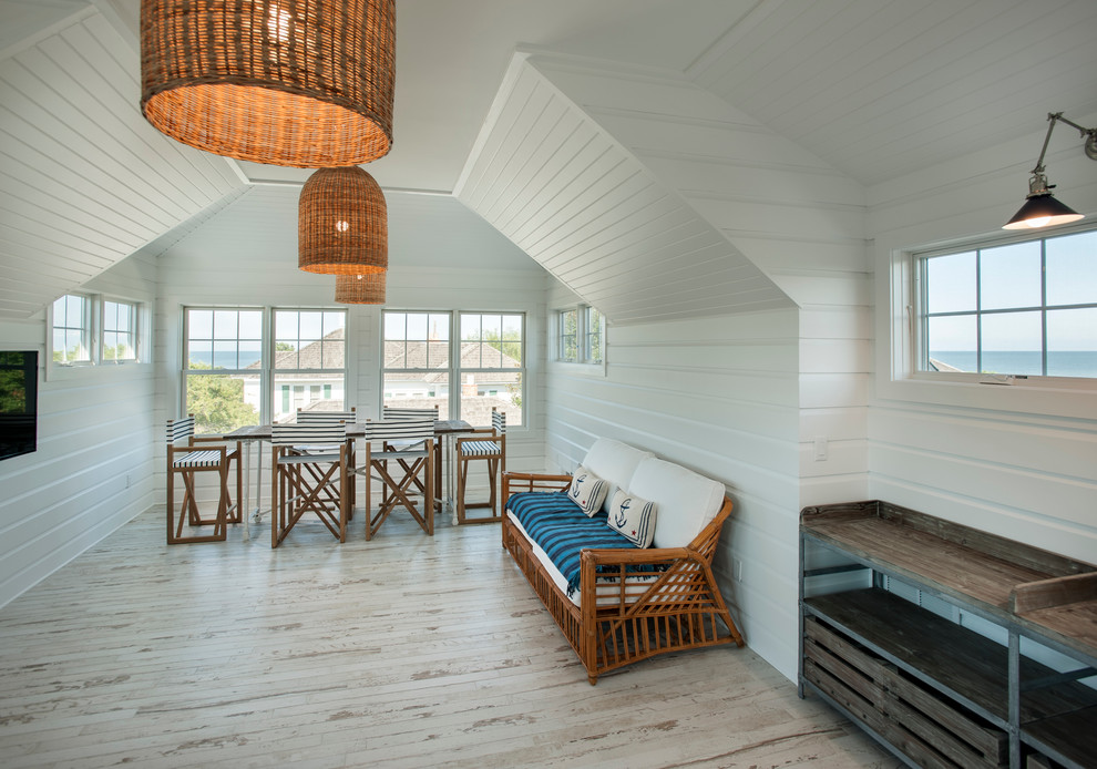 Foto di un grande soggiorno stile marino stile loft con sala giochi, pareti bianche, pavimento con piastrelle in ceramica, nessun camino e TV a parete