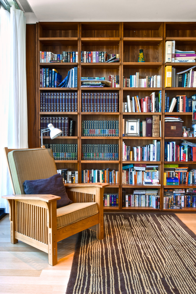 Family room - contemporary light wood floor family room idea in Toronto with white walls