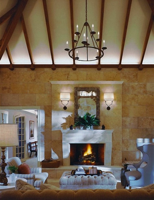 Design ideas for a large traditional enclosed games room in New York with beige walls, limestone flooring, a standard fireplace and a stone fireplace surround.