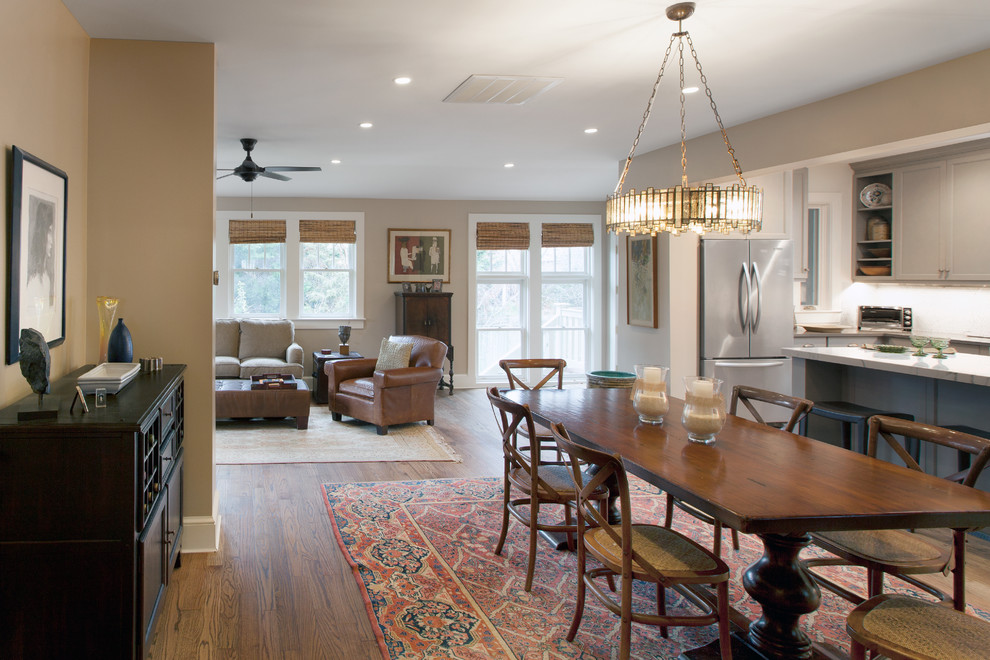 Inspiration for a large transitional medium tone wood floor dining room remodel in DC Metro with beige walls