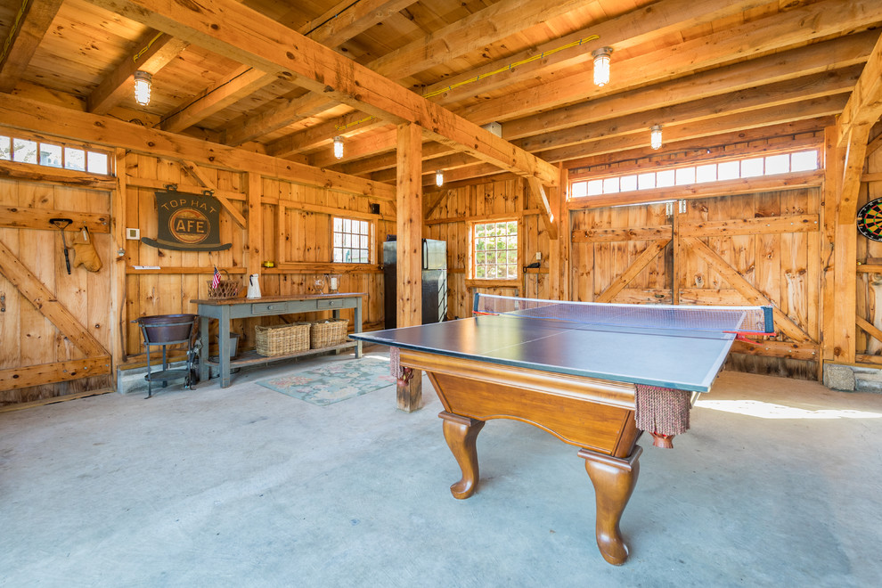 This is an example of a country games room in Bridgeport with concrete flooring and grey floors.