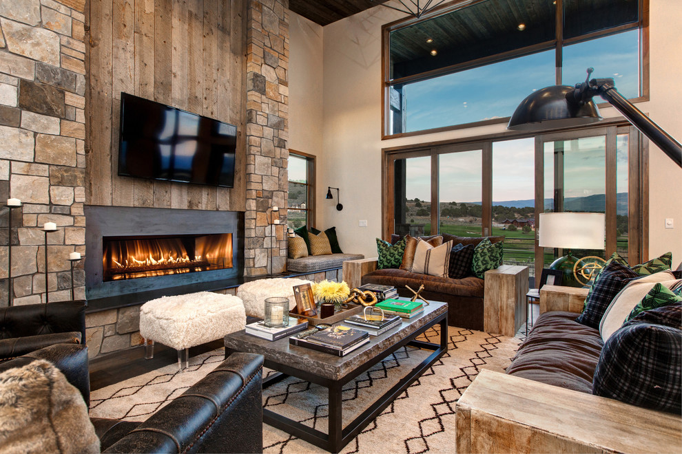 Family room - rustic family room idea in Salt Lake City with a wall-mounted tv, beige walls and a ribbon fireplace