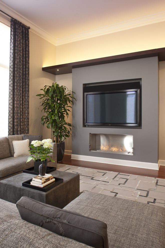 Inspiration for a contemporary games room in Chicago with beige walls, dark hardwood flooring, a ribbon fireplace and a wall mounted tv.