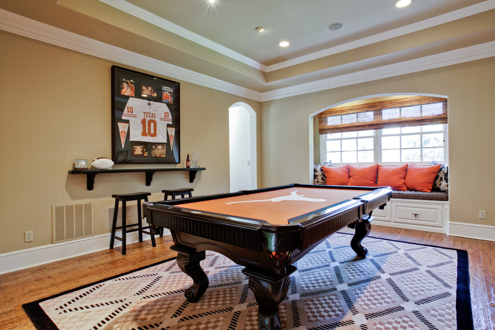 Inspiration for a traditional enclosed games room in Dallas with beige walls and medium hardwood flooring.
