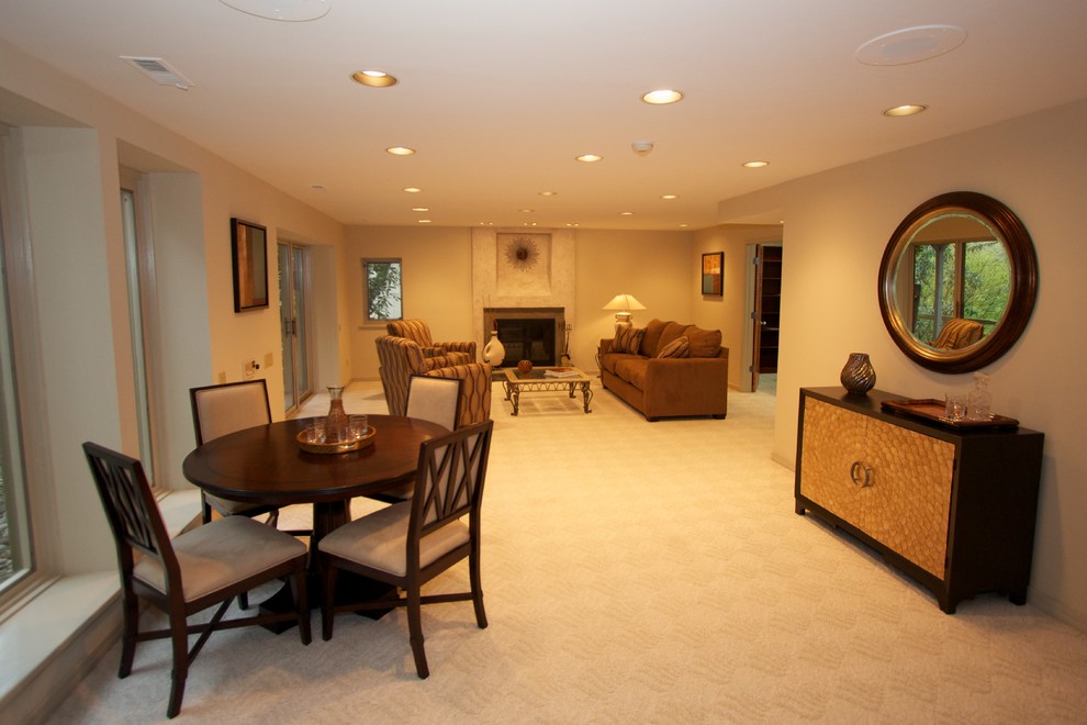 Example of a zen carpeted family room design in Philadelphia with white walls, a standard fireplace and a plaster fireplace