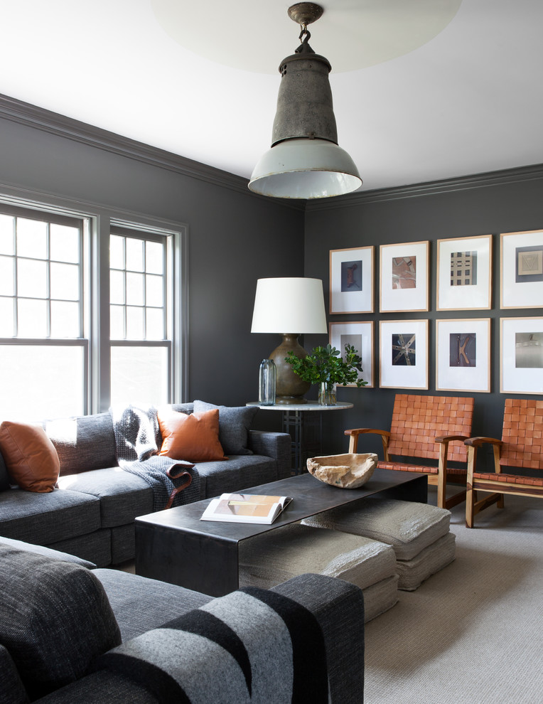 Family room - industrial carpeted and beige floor family room idea in New York with gray walls