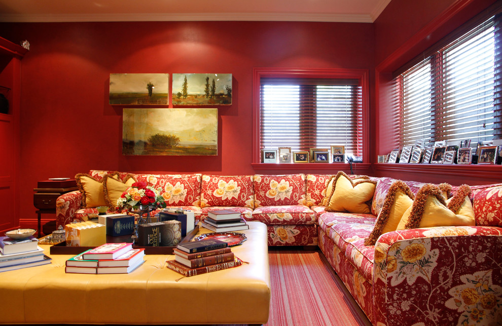 Example of a classic family room design in Montreal with red walls