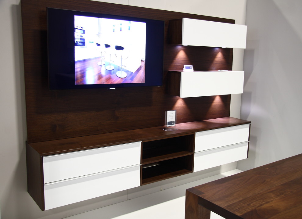 This is an example of a small modern games room in Ottawa with a wall mounted tv.