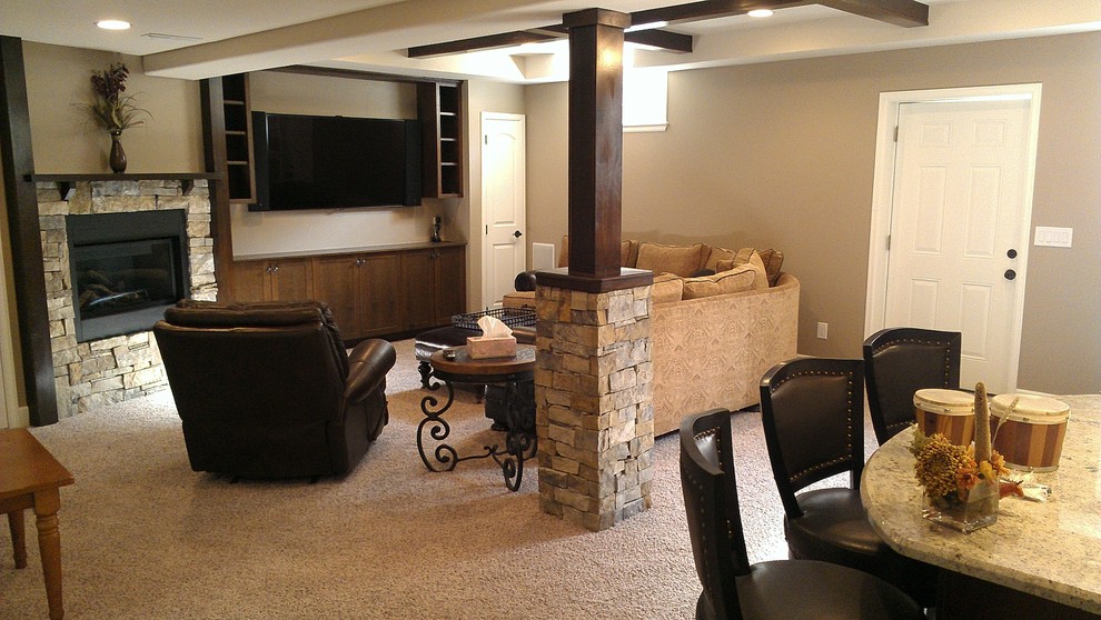 Mid-sized elegant open concept carpeted and beige floor family room photo in Denver with beige walls, a standard fireplace, a stone fireplace and a wall-mounted tv
