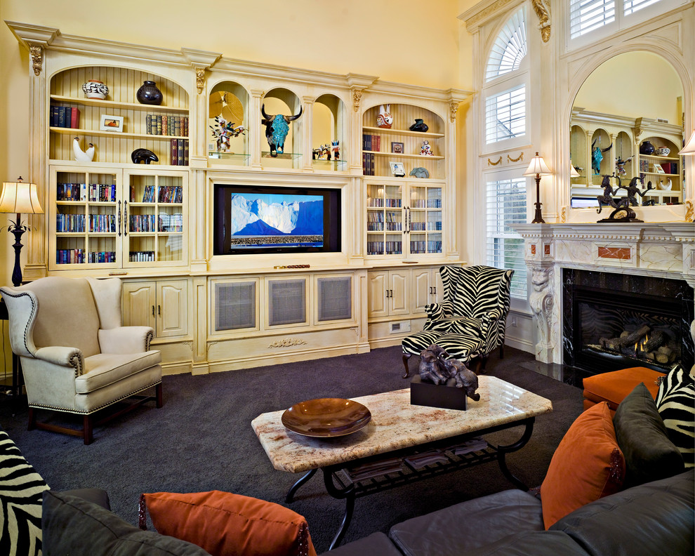 Mid-sized eclectic enclosed carpeted family room photo in Philadelphia with white walls, a standard fireplace, a wood fireplace surround and a media wall