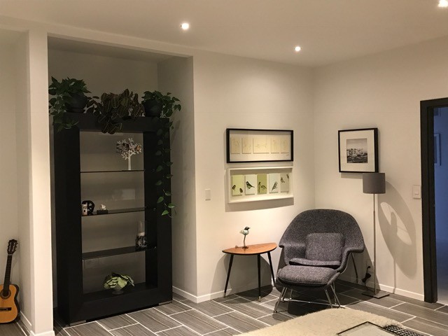 This is an example of a medium sized scandi open plan games room in Indianapolis with porcelain flooring and grey walls.