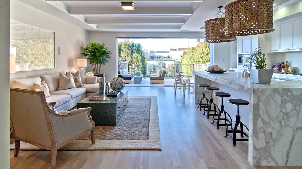 Inspiration for a transitional open concept medium tone wood floor family room remodel in San Francisco