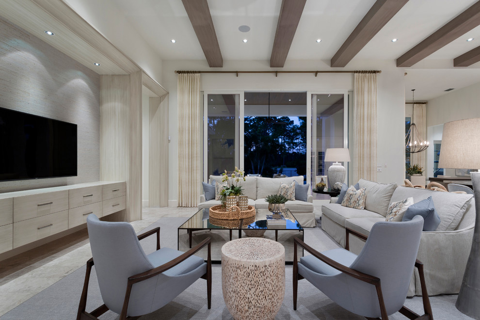 Offenes Klassisches Wohnzimmer mit weißer Wandfarbe, TV-Wand und grauem Boden in Miami