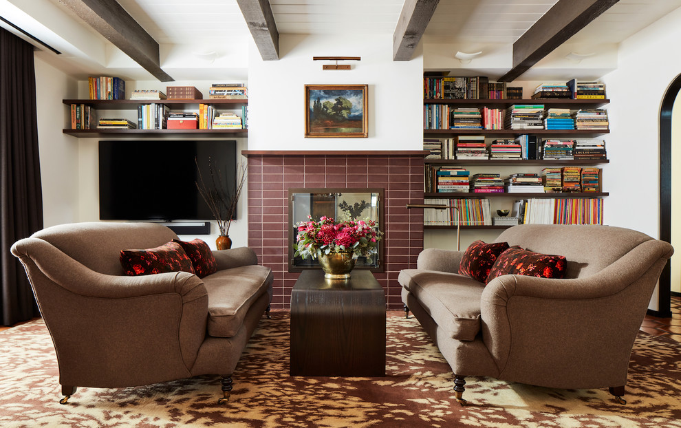 Photo of a midcentury enclosed games room in San Francisco with a reading nook, white walls, a standard fireplace, a brick fireplace surround and a wall mounted tv.