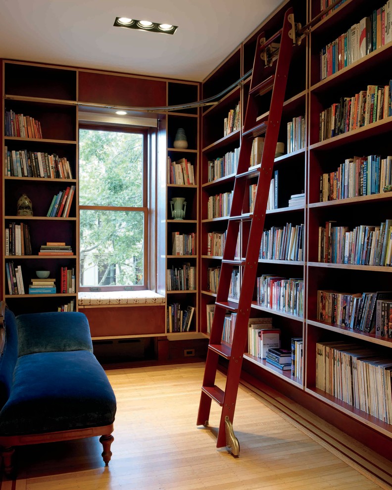Example of a trendy family room library design in New York with no fireplace and no tv