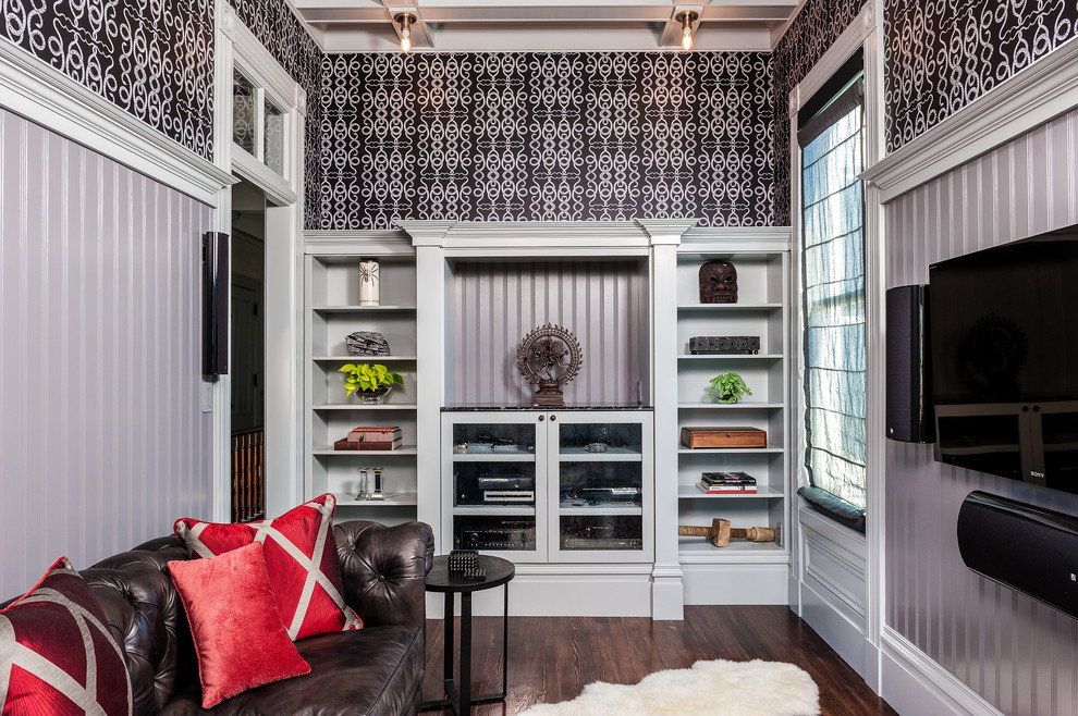 Example of a trendy enclosed dark wood floor family room design in San Francisco with gray walls, no fireplace and a wall-mounted tv