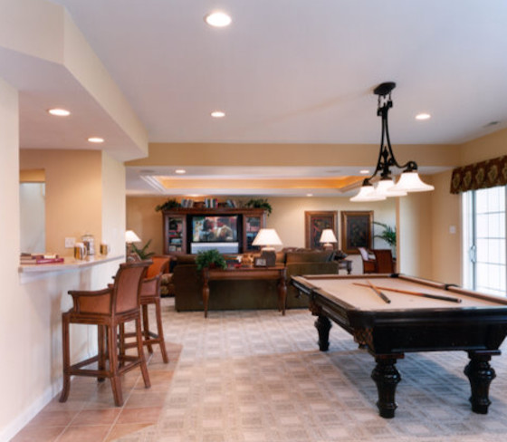 Open concept carpeted game room photo in St Louis with beige walls and no fireplace