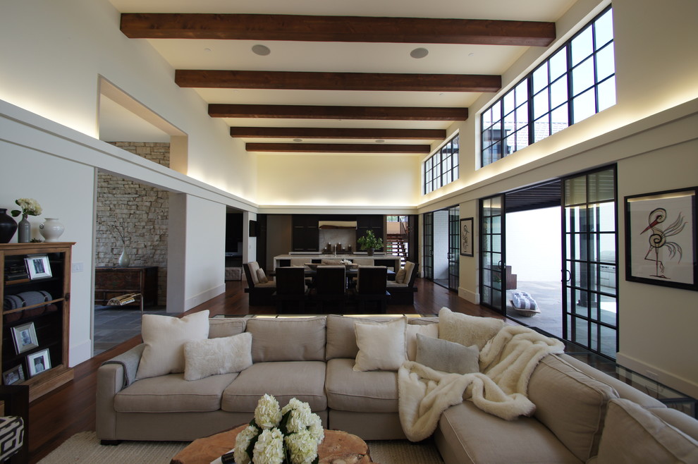 Inspiration for a large transitional open concept dark wood floor family room remodel in Chicago with white walls