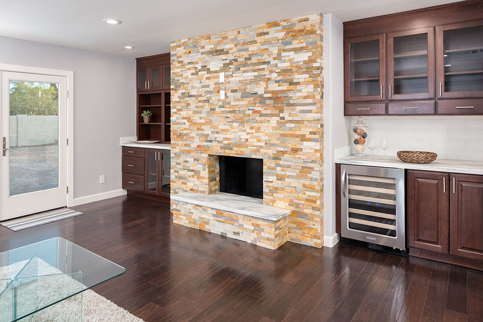 Photo of a large contemporary open plan games room in Atlanta with a home bar, grey walls, dark hardwood flooring, a standard fireplace and a stone fireplace surround.