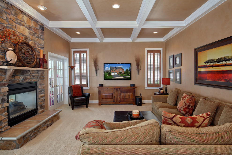 Inspiration for a timeless carpeted family room remodel in DC Metro with beige walls, a two-sided fireplace, a stone fireplace and a wall-mounted tv