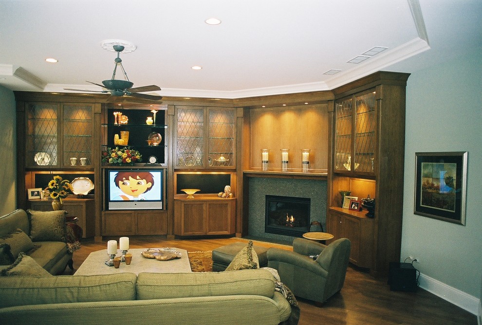 Elegant family room photo in Chicago with a tile fireplace