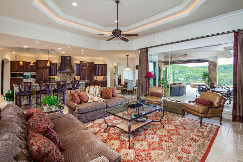 Example of a tuscan family room design in Austin