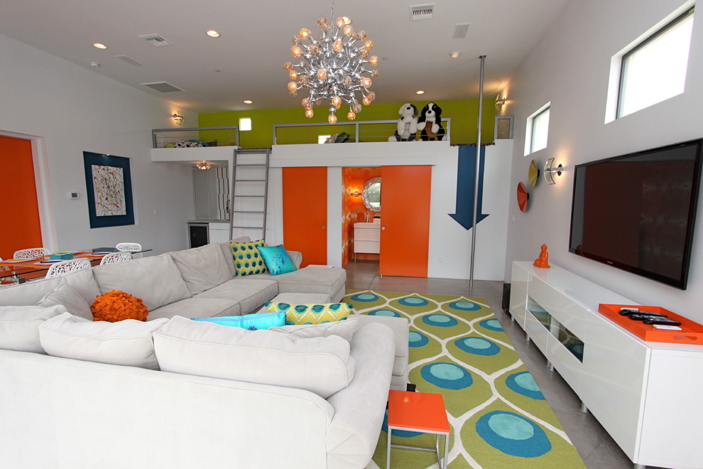 На фото: гостиная комната в современном стиле с бетонным полом и ковром на полу