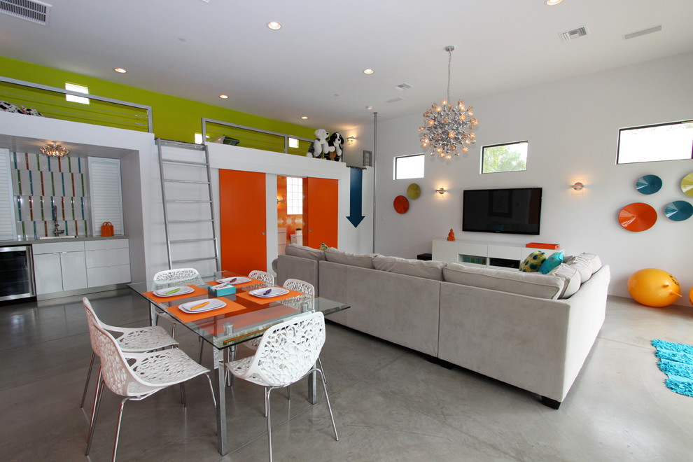 Cette image montre une salle de séjour design avec sol en béton ciré et un sol gris.