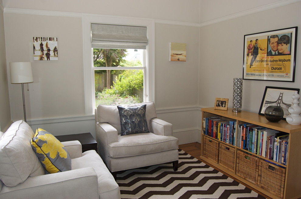 Family room - contemporary medium tone wood floor family room idea in San Francisco with beige walls