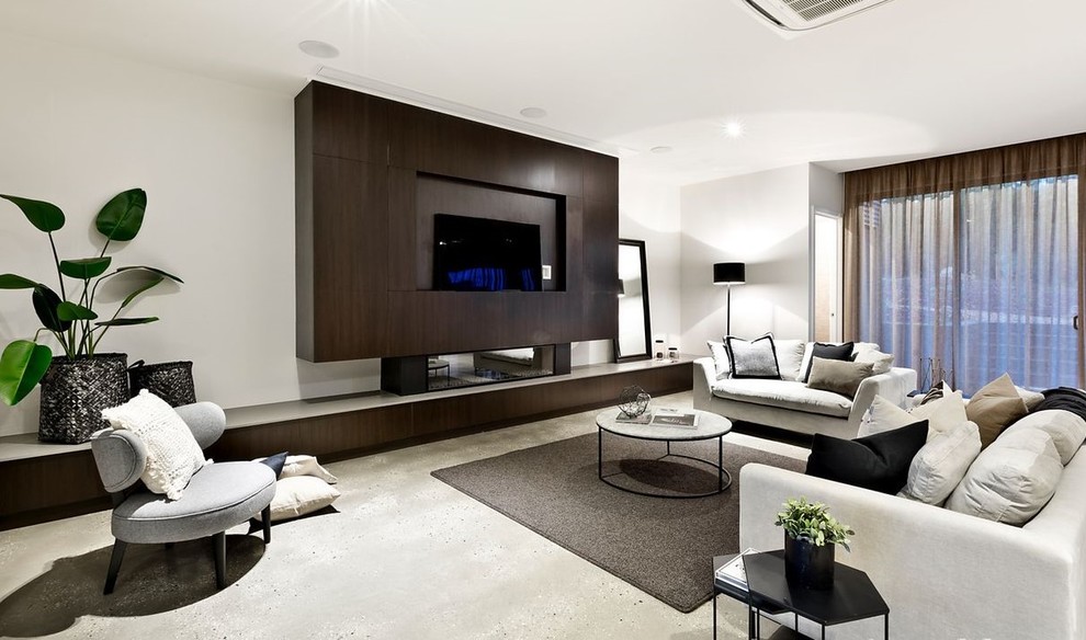 Large modern games room in Melbourne with white walls, concrete flooring, a ribbon fireplace, a wooden fireplace surround, a built-in media unit and grey floors.
