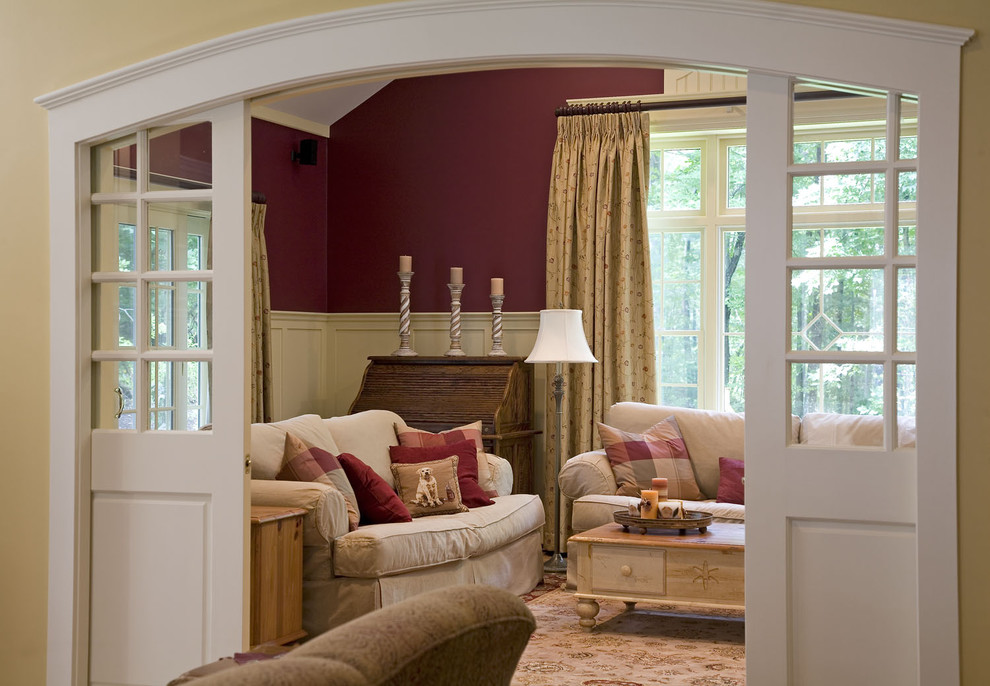 Elegant enclosed family room photo in Boston with red walls