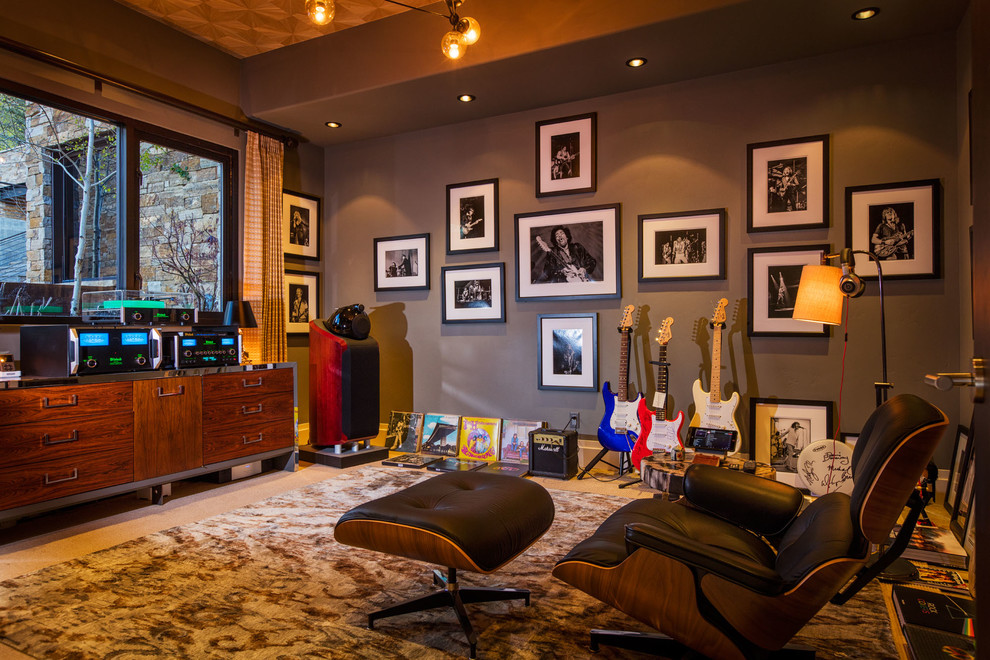 Family room - rustic enclosed carpeted family room idea in Denver with a music area and gray walls