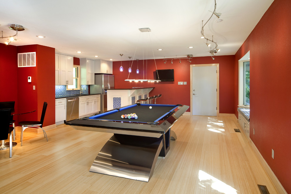 Contemporary games room in Little Rock with red walls.