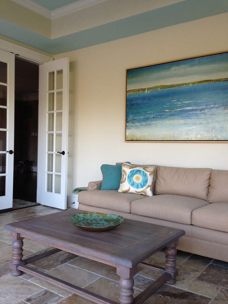 Example of a beach style family room design in DC Metro