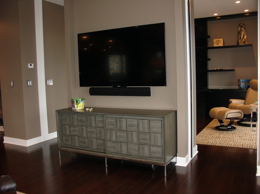 Inspiration for a classic games room in Cincinnati with beige walls, dark hardwood flooring, no fireplace and a wall mounted tv.