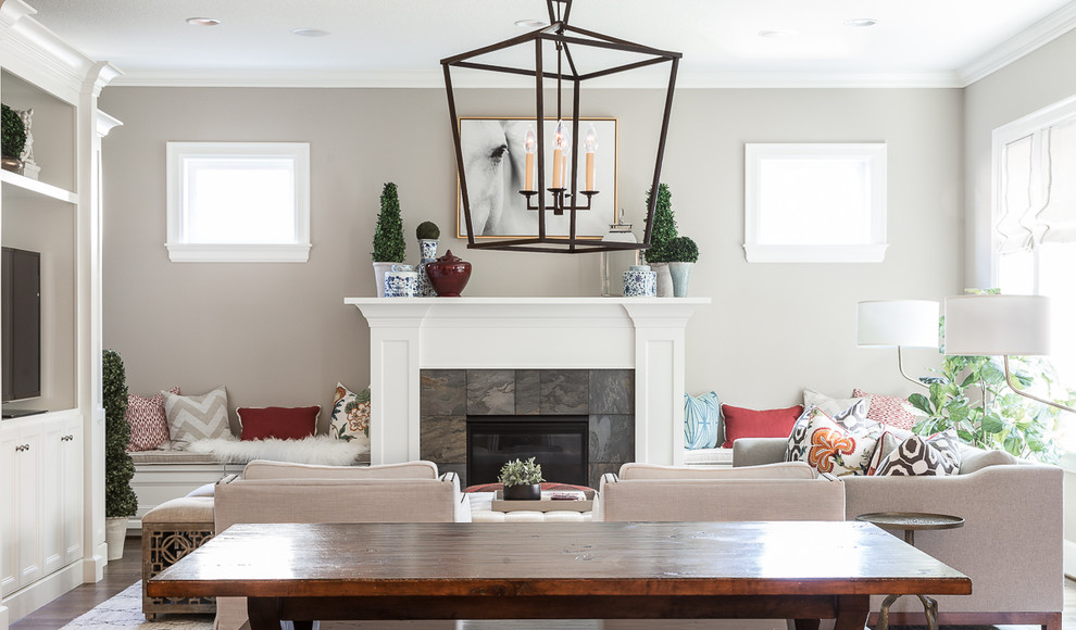 Inspiration for a mid-sized transitional open concept dark wood floor and brown floor family room remodel in Portland with beige walls, a standard fireplace, a tile fireplace and a media wall