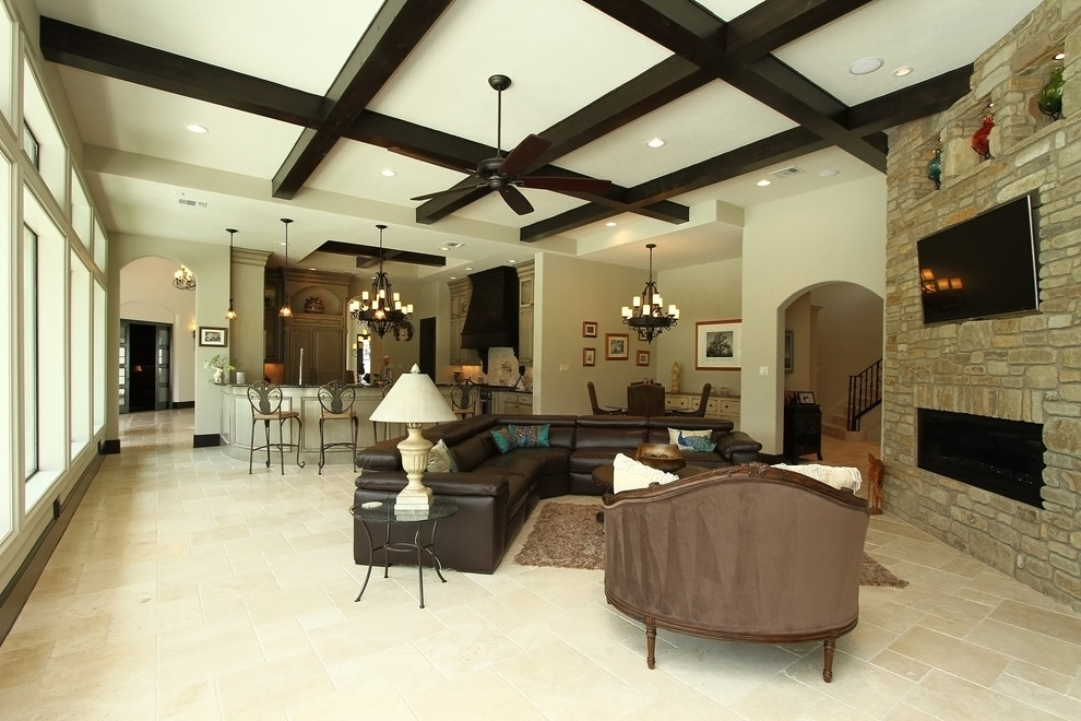 Design ideas for a large mediterranean open plan games room in Houston with beige walls, travertine flooring, a corner fireplace, a brick fireplace surround and a wall mounted tv.