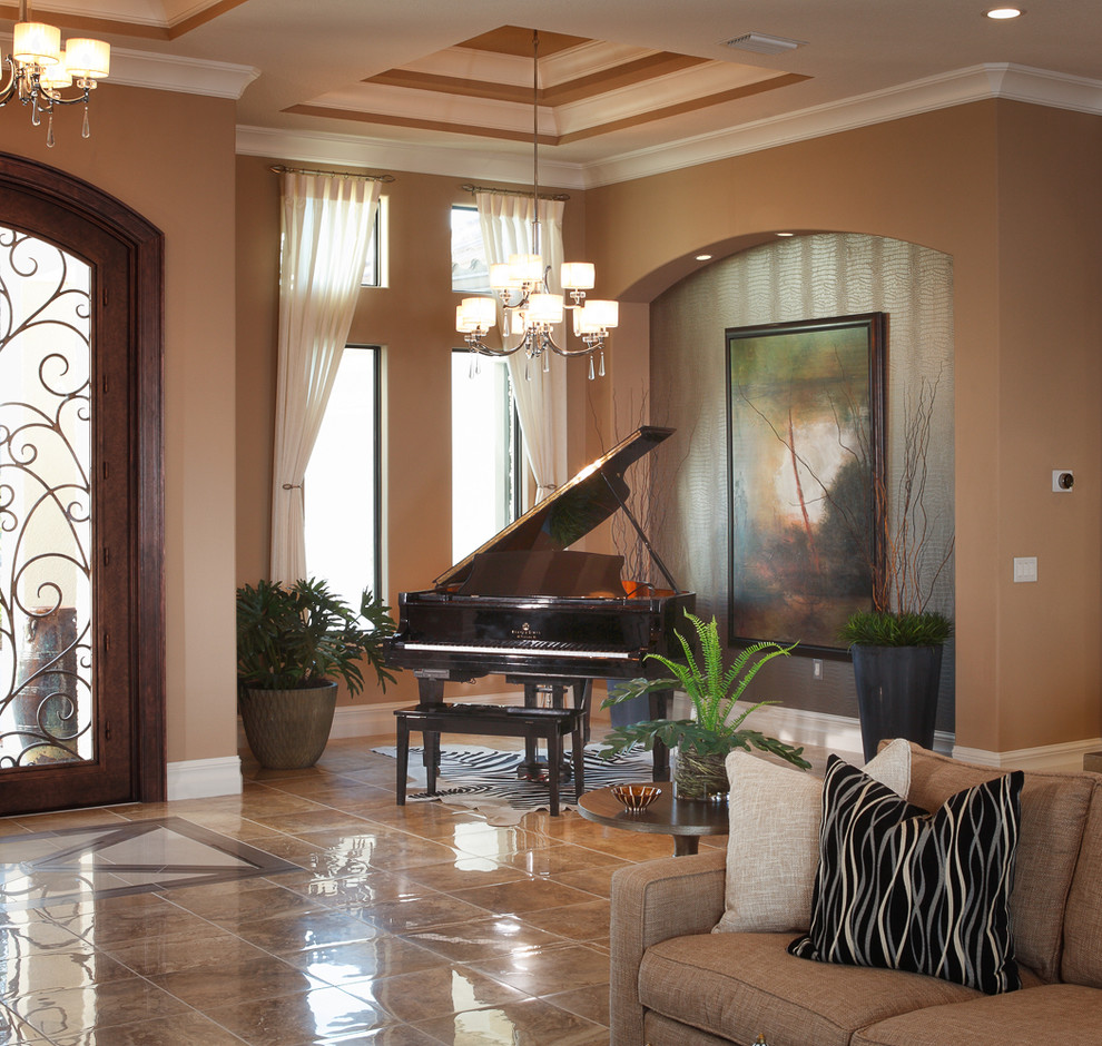 Photo of a classic open plan games room in Orlando with beige walls, porcelain flooring, a ribbon fireplace, a wall mounted tv and beige floors.